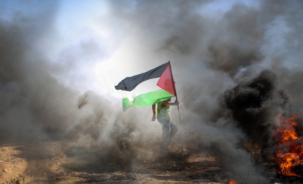 man, palestinian flag, smoke-6860636.jpg